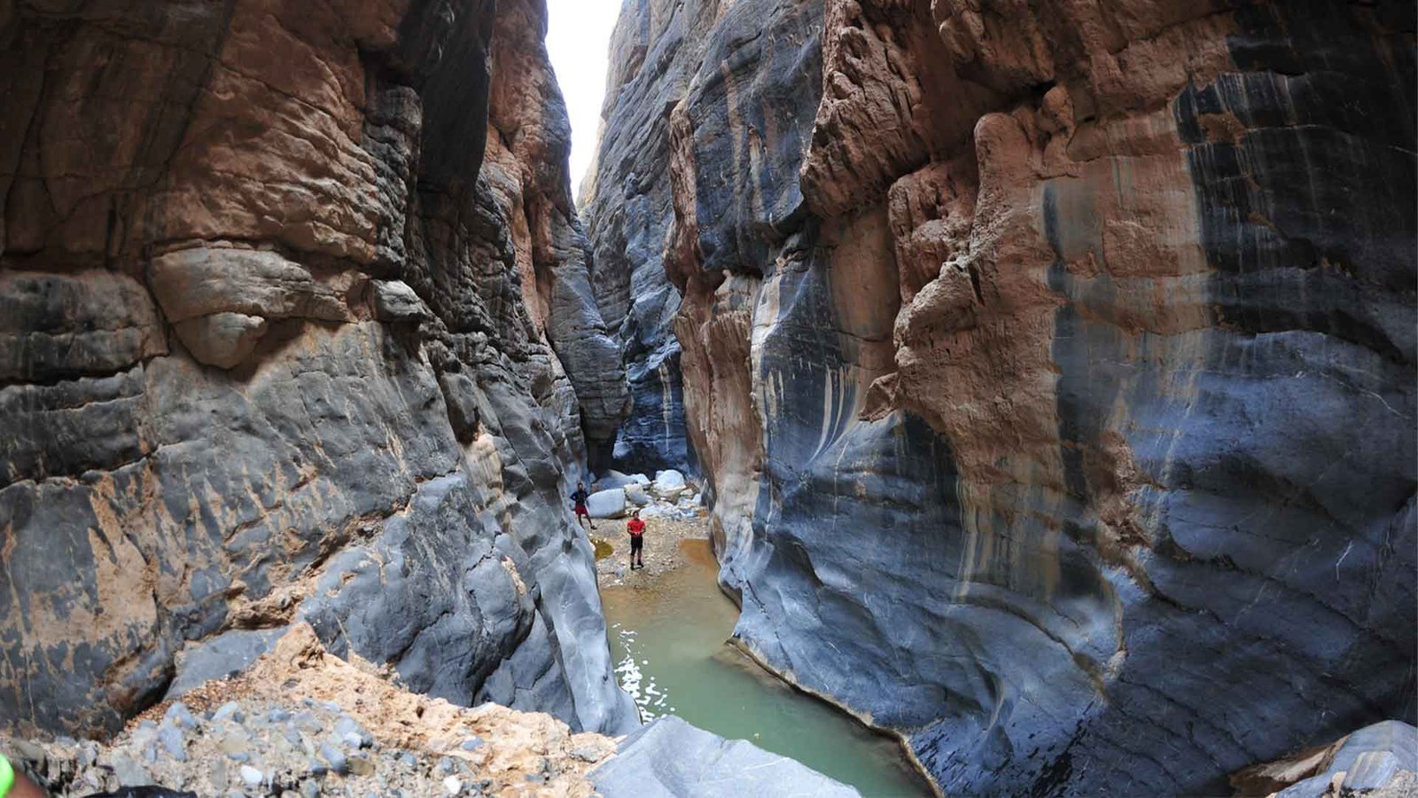 This image captures the dramatic landscape of this famous trail in the Al Hajar Mountains, highlighting the challenging and adventurous nature of Oman Hiking Trails.